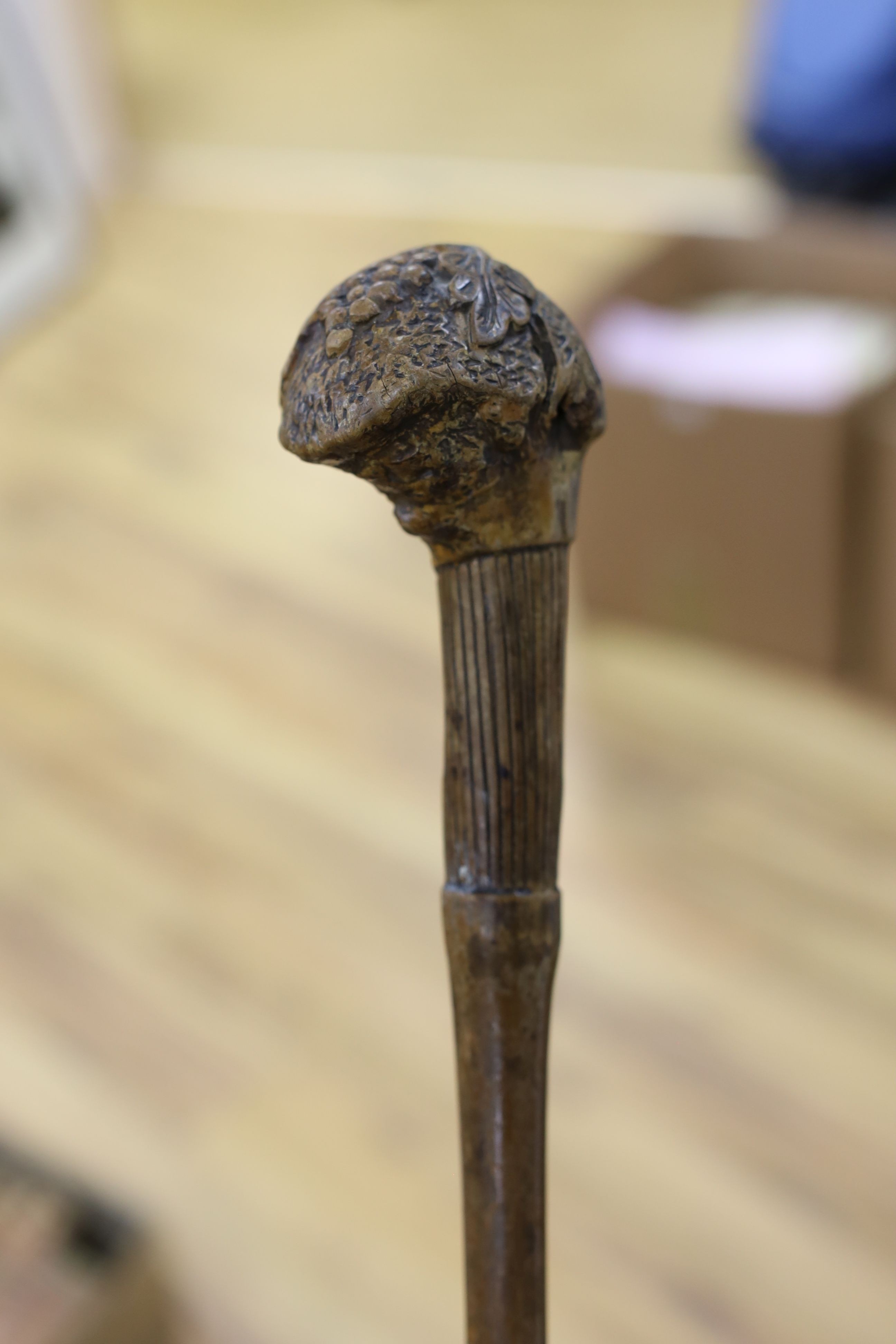 A 19th century folk art walking stick, 89 cms long.